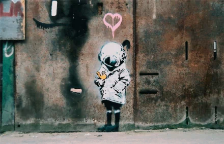 HD desktop wallpaper featuring artistic graffiti of a child holding a bird, with a pink heart above, symbolizing love against a textured, urban background.
