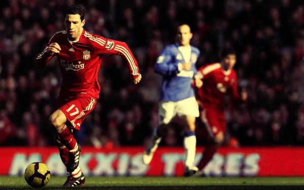 HD PC desktop wallpaper featuring Maxi Rodriguez in action on the soccer field, highlighting a dynamic sports moment.
