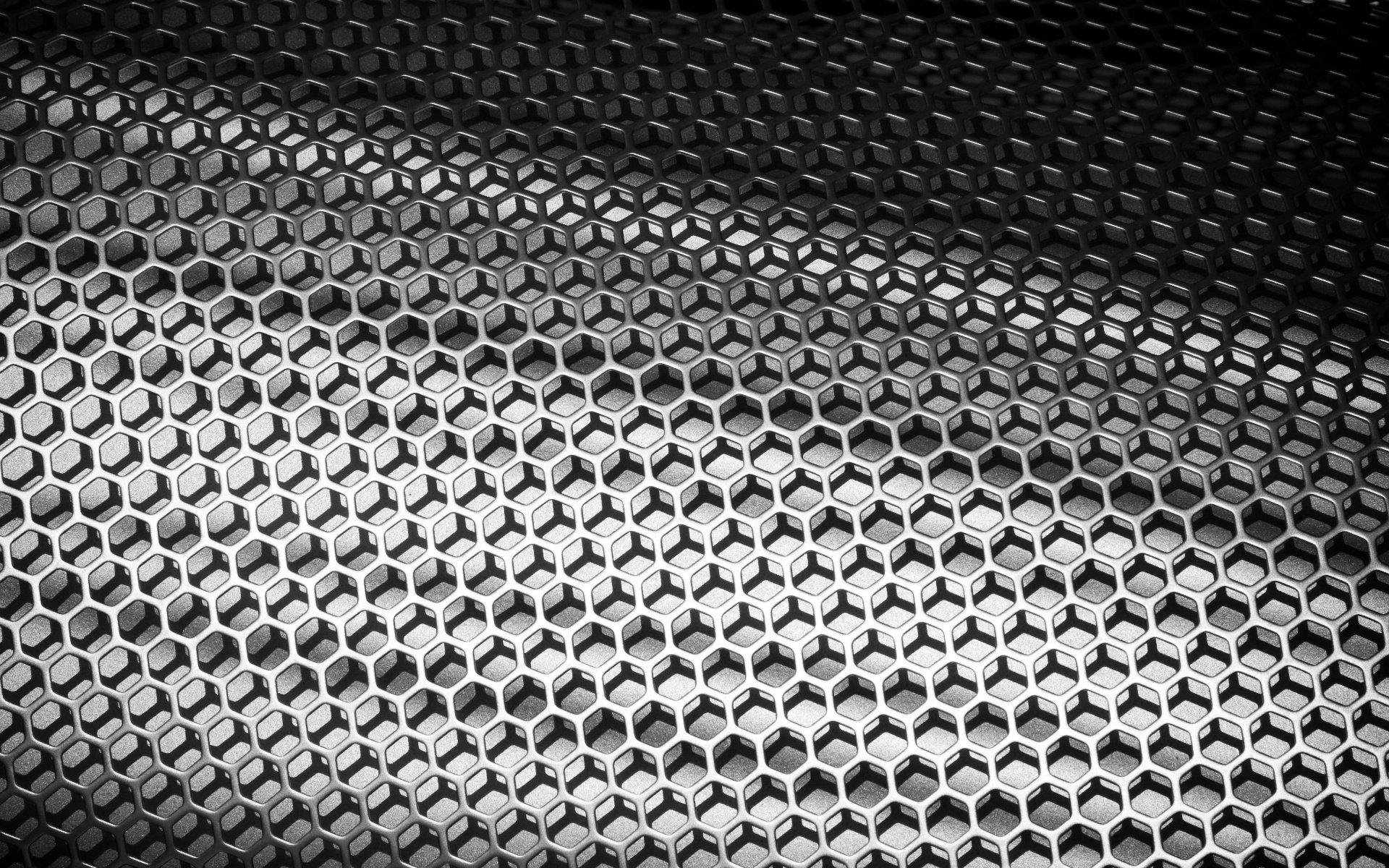 Abstract artistic HD PC desktop wallpaper featuring a metallic honeycomb pattern with dynamic light and shadow contrasts creating depth and texture.