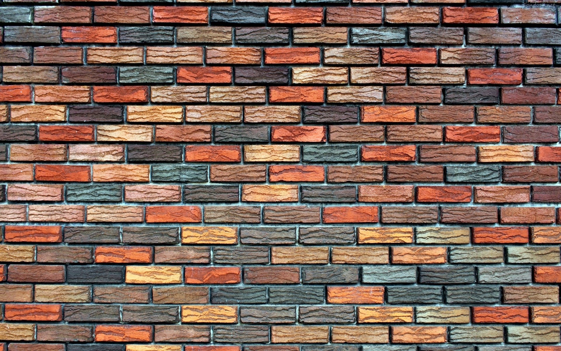 An abstract artistic wallpaper featuring a textured wall of colorful bricks, showcasing a harmonious blend of warm and cool tones for a striking HD background.