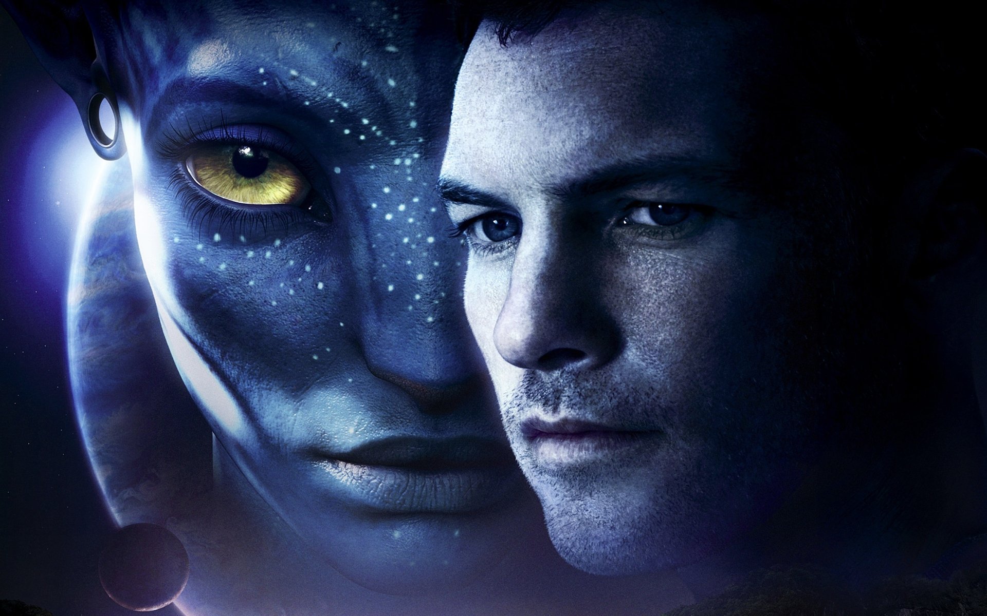HD PC desktop wallpaper featuring a close-up of two faces from the movie Avatar, blending a blue-skinned Na'vi with a human character against a dark background.