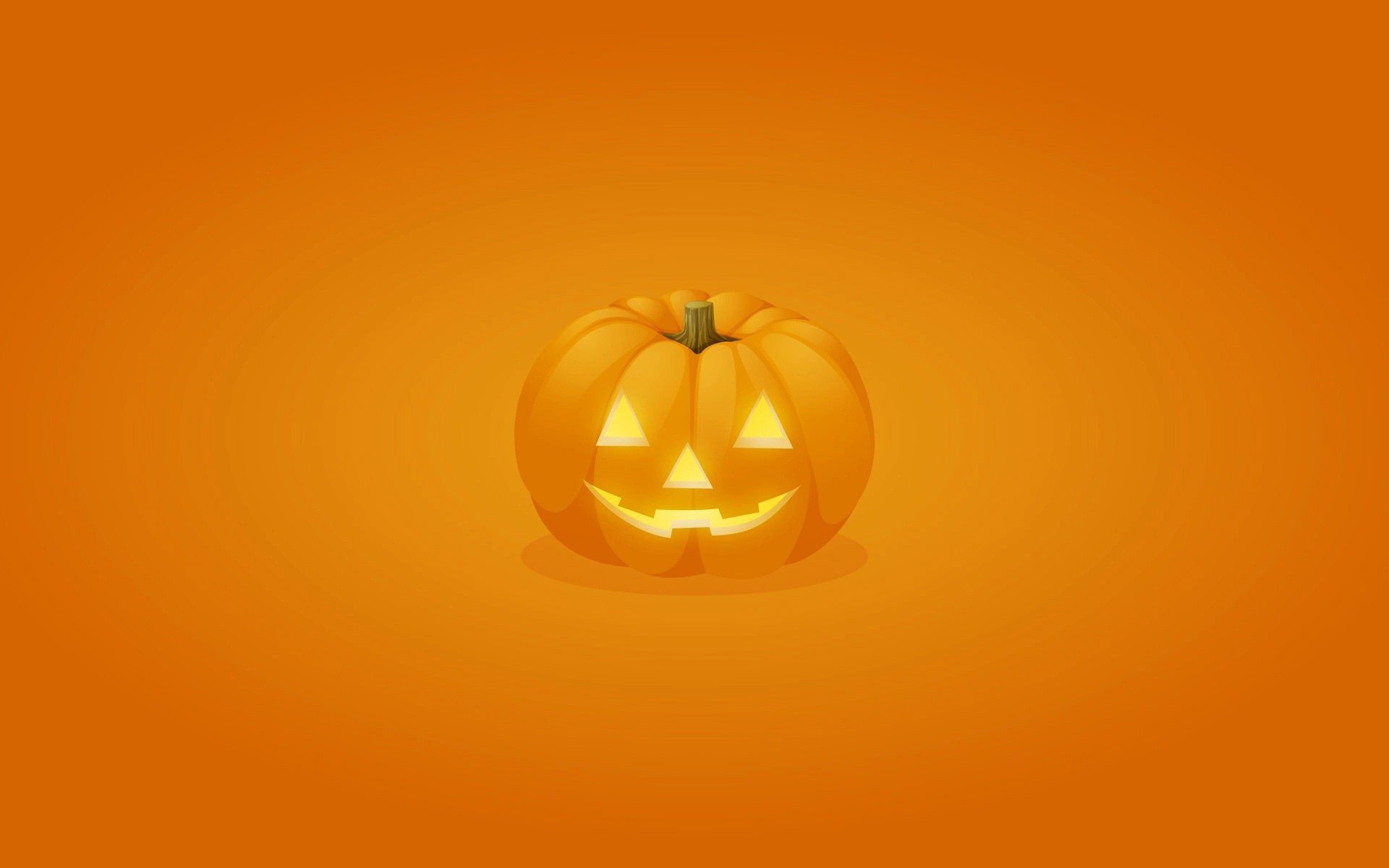 A vibrant HD Halloween wallpaper featuring a glowing jack-o'-lantern against an orange background, capturing the festive spirit of the holiday.