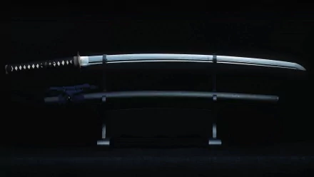 A sleek, man-made sword is displayed prominently against a dark background, showcasing its elegant design. This HD image serves as an eye-catching desktop wallpaper.