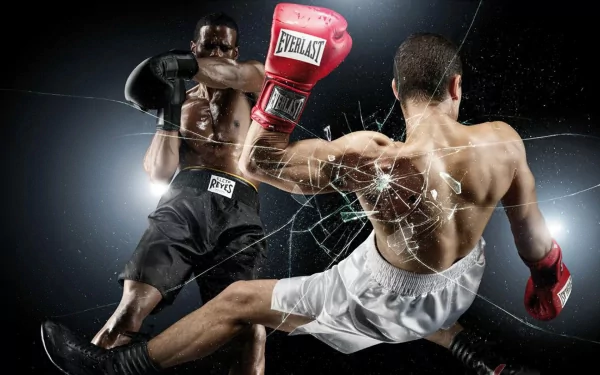 HD PC desktop wallpaper showing an intense boxing match with one fighter landing a powerful punch, surrounded by dynamic motion and a shattered glass effect.