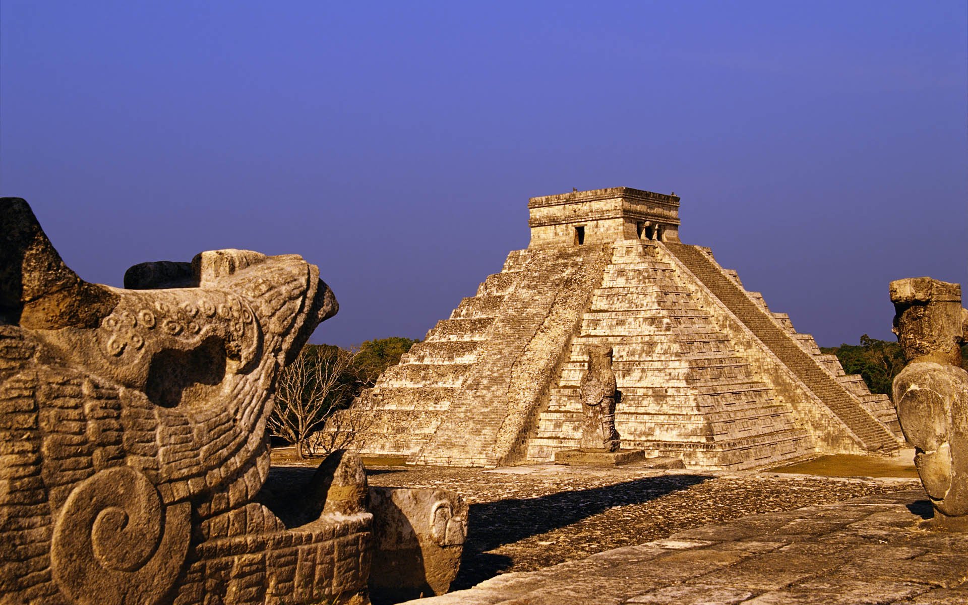 HD desktop wallpaper showcasing the man-made ancient pyramid of Chichen Itza under a clear blue sky.
