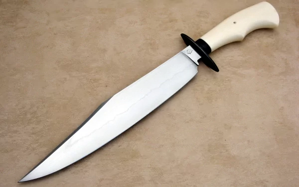 A high-definition desktop wallpaper featuring a sharp, sleek knife with a white handle, showcasing exquisite craftsmanship and attention to detail against a textured background.