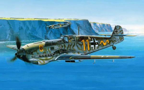 HD desktop wallpaper featuring a military Messerschmitt Bf 109 fighter plane flying over a coastal cliff with another plane in the background.