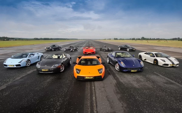 A stunning HD desktop wallpaper featuring a lineup of iconic cars from the TV show Top Gear, set against a dramatic sky on an airstrip background.