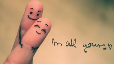 Artistic HD wallpaper depicting two fingers with smiling faces drawn on them, embraced and accompanied by the text I'm all yours, symbolizing love and affection.