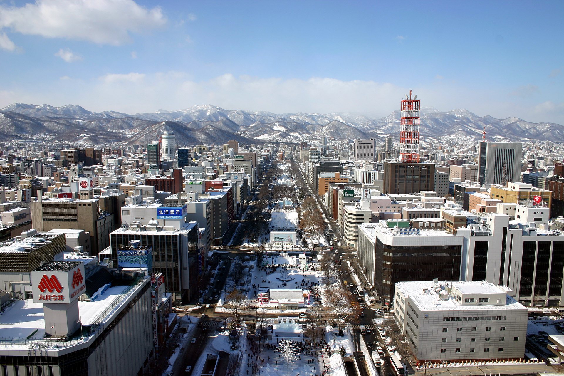 Snow-covered cityscape with mountains in Japan