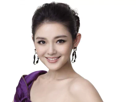 HD PC desktop wallpaper featuring a smiling portrait of celebrity Barbie Hsu with elegant earrings and a purple off-shoulder outfit against a white background.