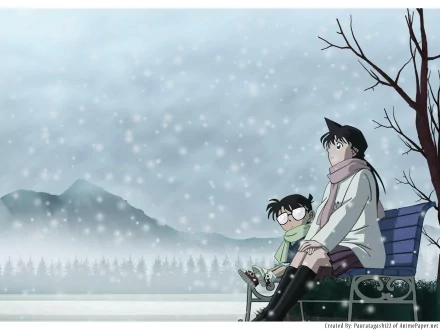 In a serene winter scene, Ran Mouri and Shinichi Kudo, alongside Conan Edogawa, sit on a bench amidst falling snow, capturing a moment of tranquility in the world of Detective Conan.