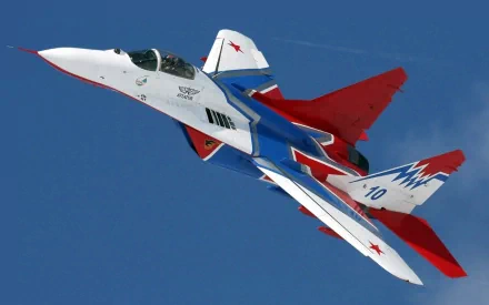 HD desktop wallpaper of a colorful military jet fighter soaring in a clear blue sky, tagged with keywords military and jet fighter.