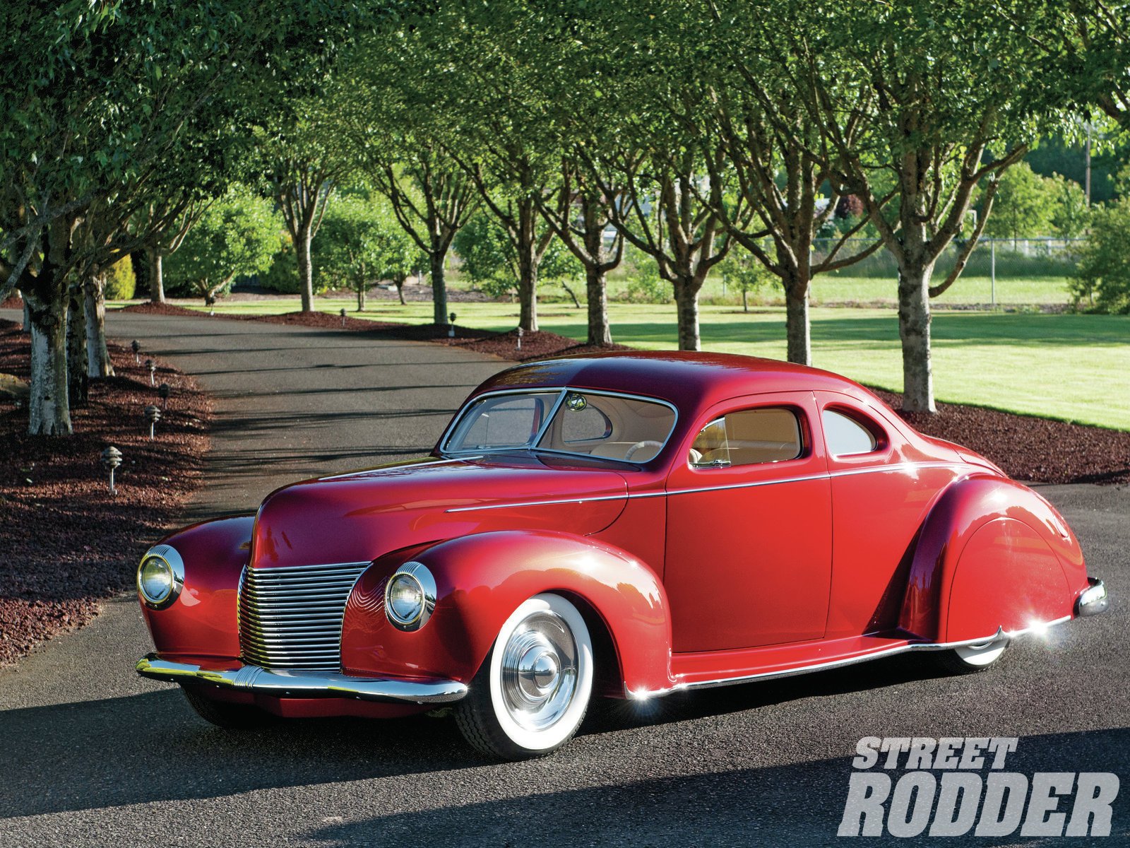 HD PC desktop wallpaper background: red classic Ford vehicle coupe with chrome wheels, glossy paint parked on a tree-lined road.