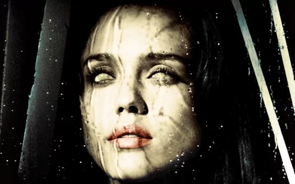 HD desktop wallpaper: close-up of a pale, rain-streaked woman with clouded white eyes, cinematic horror mood inspired by the movie The Eye.