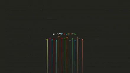 A motivational HD desktop wallpaper featuring multicolored arrows pointing upward with the text STAY POSITIVE in the center, set against a dark background.