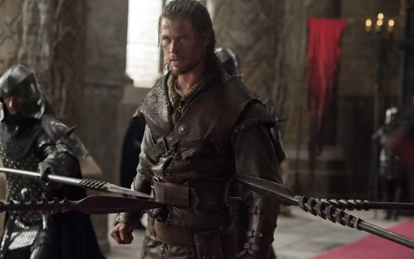 Rugged huntsman in leather armor from the Snow White and the Huntsman movie, posed in a dim medieval hall — HD PC desktop wallpaper/background.