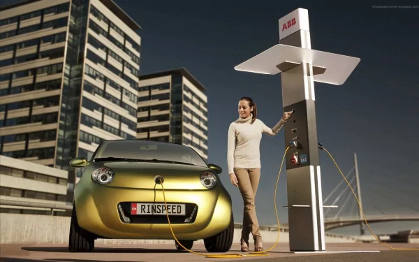 A woman stands beside a green electric car parked at a charging station, with modern buildings in the background, showcasing a contemporary automotive lifestyle in this HD desktop wallpaper.