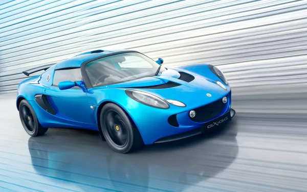 HD PC desktop wallpaper featuring a sleek blue Lotus sports car speeding on a reflective surface with a modern, metallic backdrop.
