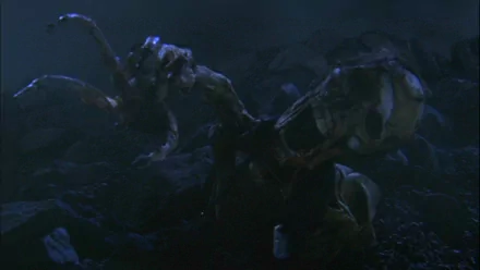 HD PC desktop wallpaper and background from the movie Starship Troopers 2: Hero of the Federation, showing a looming Arachnid creature emerging from a dark, foggy battlefield.