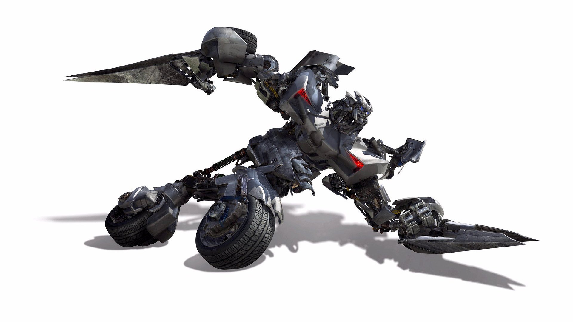 HD PC desktop wallpaper featuring a dynamic robotic character from the movie Transformers in a crouching battle stance against a white background.