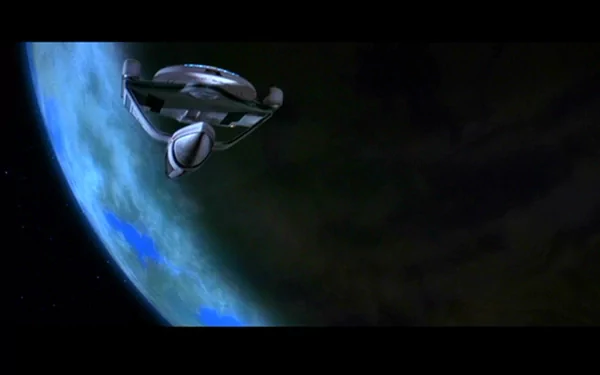 A dynamic scene from Star Trek III: The Search for Spock, featuring a starship soaring through space near a planet, making for an engaging HD desktop wallpaper and background.