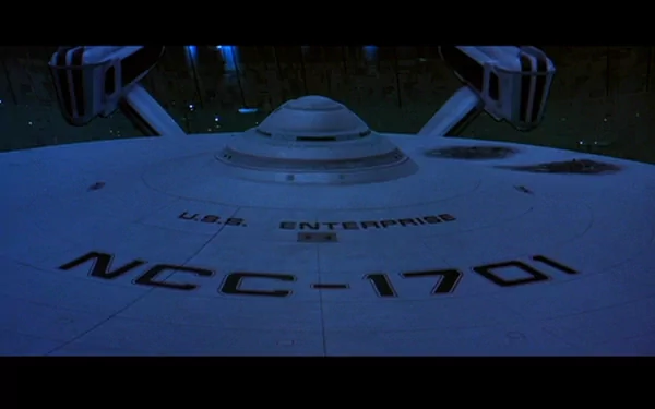 A striking HD wallpaper featuring the U.S.S. Enterprise from Star Trek III: The Search for Spock, showcasing its iconic design against a dark cosmic backdrop.