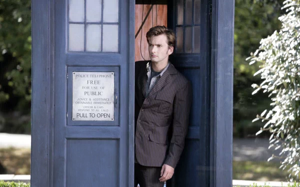 A high-definition wallpaper featuring the Doctor, standing in the Tardis, from the TV show Doctor Who (2005).