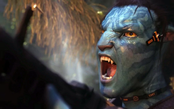 A close-up of Jake Sully, portrayed by Sam Worthington, showcases a fierce expression with vibrant blue skin and sharp features, capturing a moment from the movie Avatar.