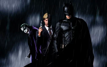 HD PC wallpaper featuring Joker, Harvey Dent as Two-Face, and Batman from the movie The Dark Knight, standing in the rain with a dark, intense atmosphere.