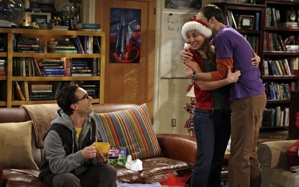 HD wallpaper featuring Kaley Cuoco, Jim Parsons as Sheldon Cooper, and Johnny Galecki as Leonard Hofstadter from the TV show The Big Bang Theory in the living room set.