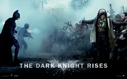 HD desktop wallpaper featuring Batman facing Bane in a dramatic scene from the movie The Dark Knight Rises.