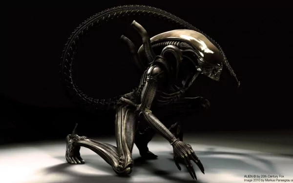 A striking HD desktop wallpaper featuring a menacing alien creature, showcasing its intricate design and cinematic presence in a dark setting.