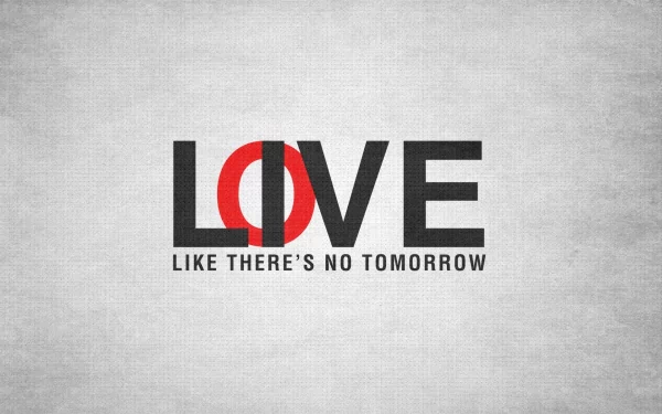 HD desktop wallpaper with a motivational message: LOVE LIKE THERE'S NO TOMORROW on a textured gray background. The word LOVE is creatively designed, emphasizing passion and urgency.