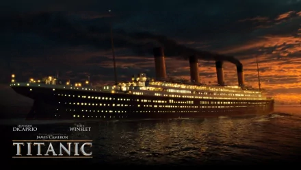 HD desktop wallpaper of the ship Titanic from the movie Titanic, featuring the iconic vessel illuminated against a dramatic sunset background.