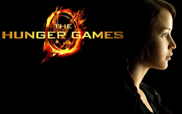 HD wallpaper featuring Katniss Everdeen, portrayed by Jennifer Lawrence, alongside the iconic logo of The Hunger Games. A striking and dramatic background for fans of the series.