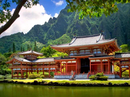 HD desktop wallpaper featuring a traditional Japanese man-made building set against a lush, green mountainous backdrop.