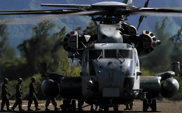 HD military desktop wallpaper featuring a powerful Sikorsky CH-53E Super Stallion helicopter with soldiers walking alongside in the background.