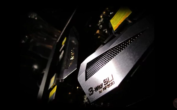 Close-up HD desktop wallpaper of Nvidia's 3-way SLI graphics card setup, highlighting advanced technology and sleek hardware design.
