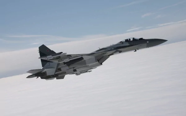 A Sukhoi Su-35 warplane soaring through the sky, showcasing its military aircraft design. This high-definition image serves as an impressive desktop wallpaper.