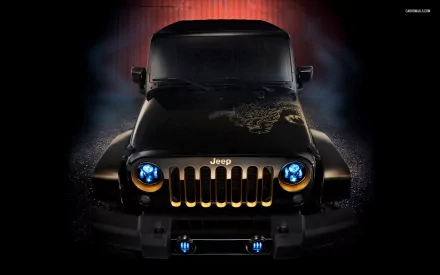 HD desktop wallpaper featuring a black Jeep Wrangler with distinctive blue headlights, a decorated hood, and a bold grille, captured in a dramatic front-facing view.