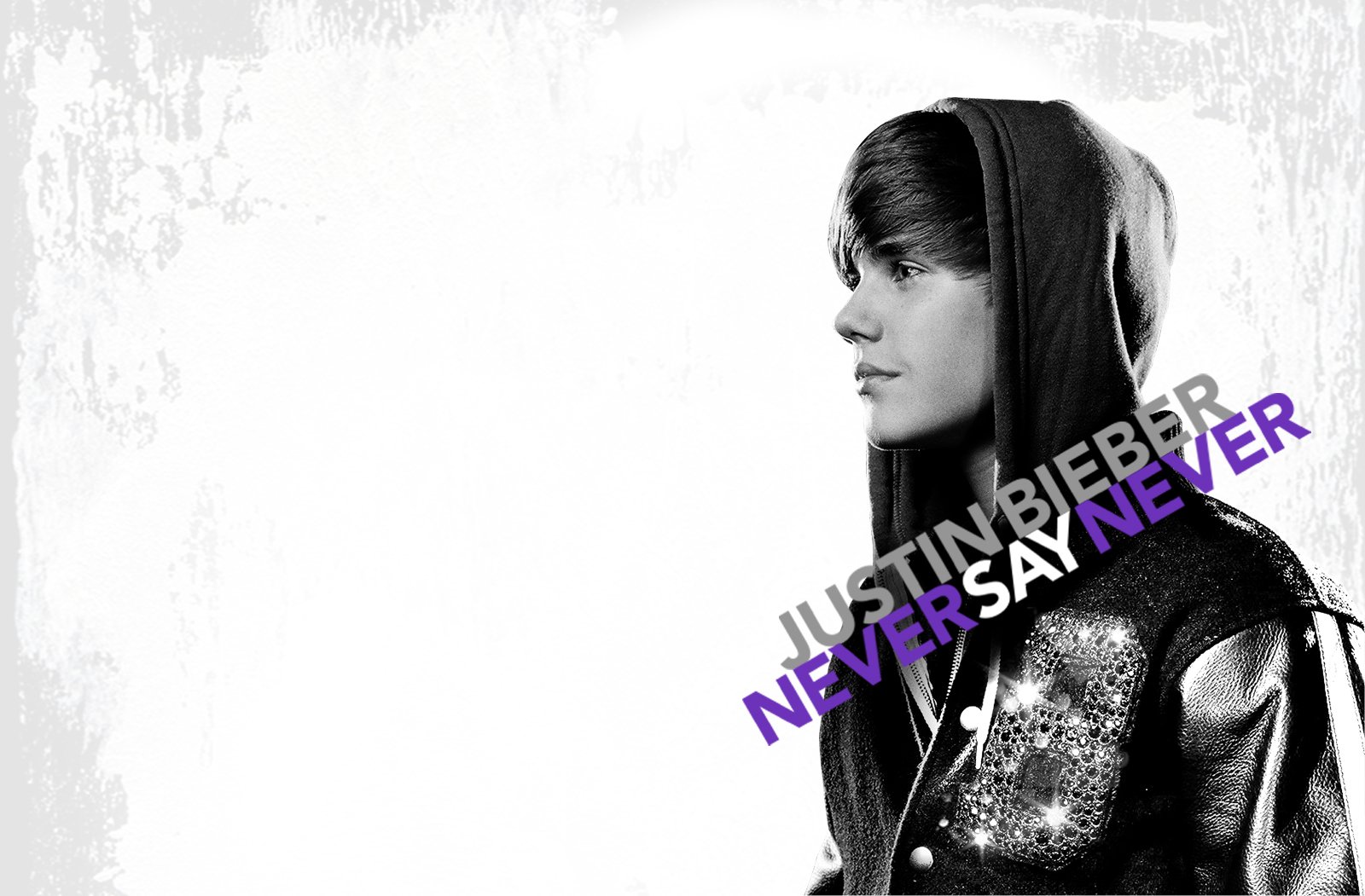 Black and white HD desktop wallpaper featuring Justin Bieber with the text Never Say Never in purple.