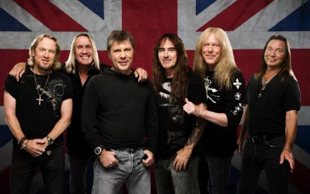 A high-definition desktop wallpaper featuring the iconic British heavy metal band Iron Maiden, posing in front of a striking Union Jack backdrop.