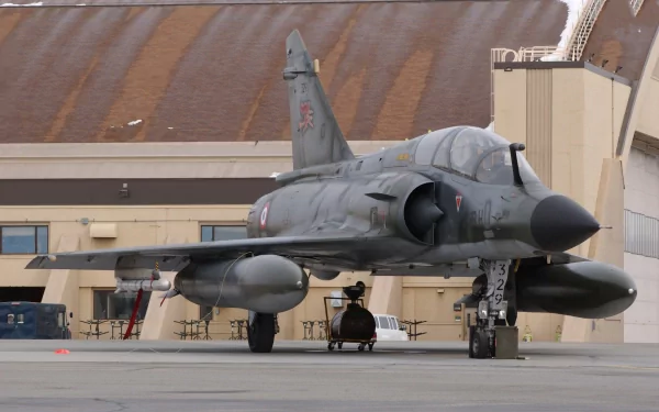 Military Dassault Mirage 2000 fighter jet parked on an airbase tarmac, captured in high definition for a PC desktop wallpaper and background.
