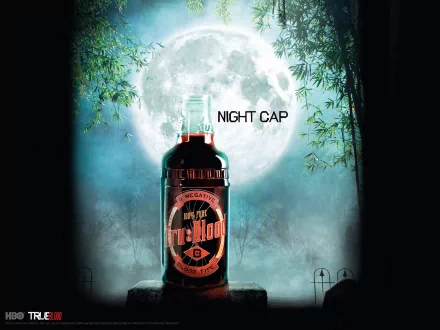 A dramatic HD wallpaper featuring a bottle labeled True Blood against a full moon backdrop, with the text NIGHT CAP, evoking the mysterious atmosphere of the TV show.