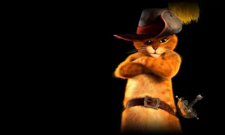 HD desktop wallpaper featuring Puss in Boots, the iconic feline from the movie, wearing his signature hat and belt, standing confidently with arms crossed against a dark background.