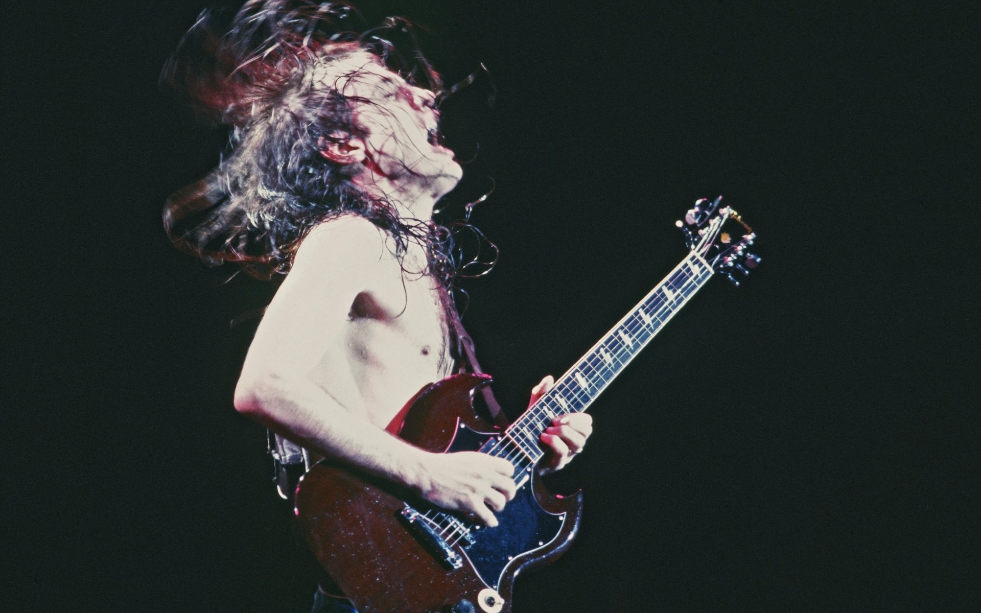 Angus Young in Action: Iconic AC/DC HD Wallpaper