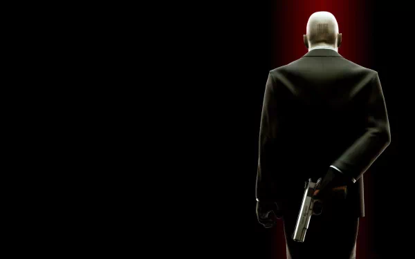 A striking 8K Ultra HD wallpaper featuring a character from the video game Hitman, standing confidently with a gun hidden behind their back against a dark, dramatic background.
