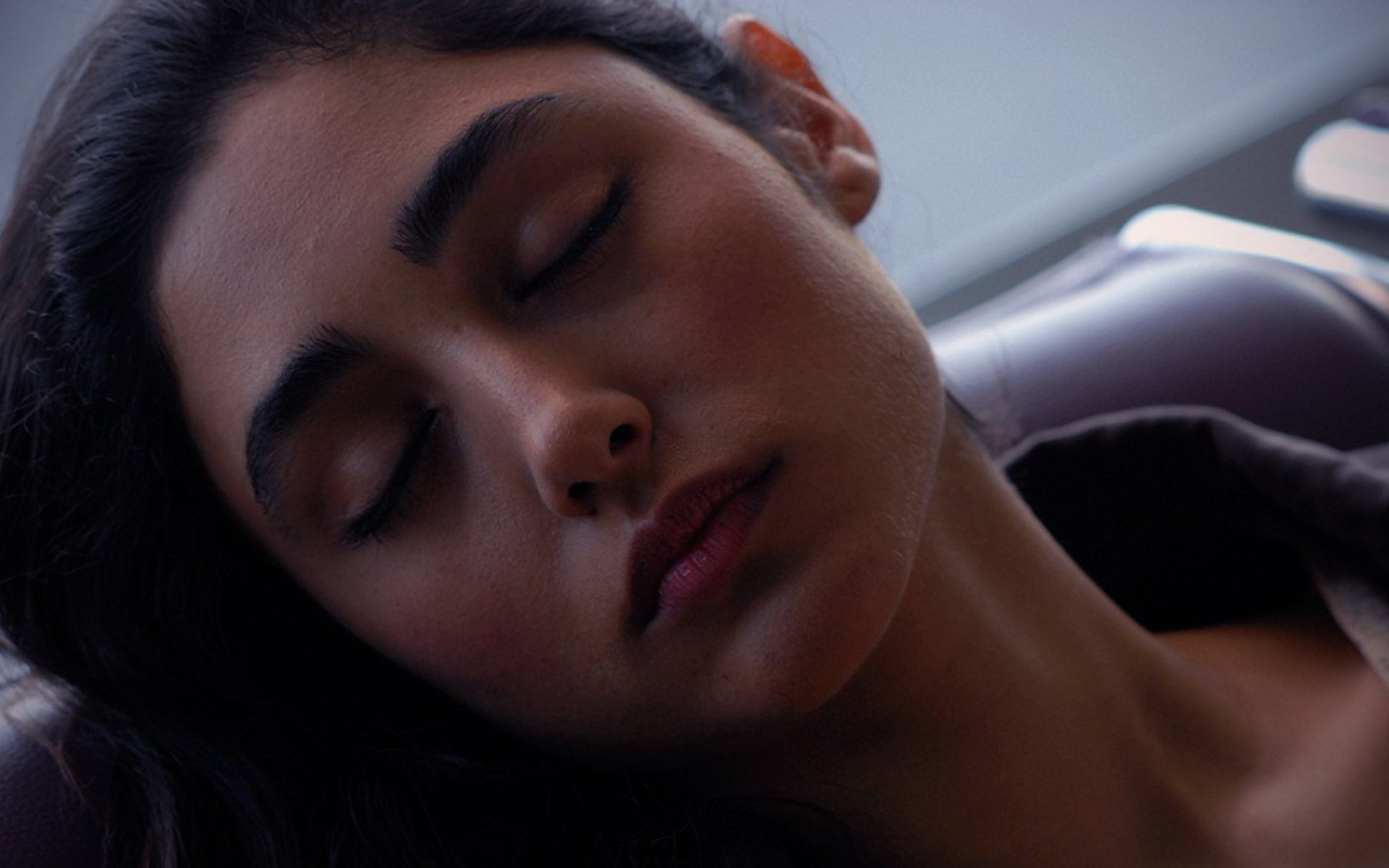 Close-up HD desktop wallpaper of celebrity Georgia Salpa with eyes closed, showcasing a serene and natural expression.