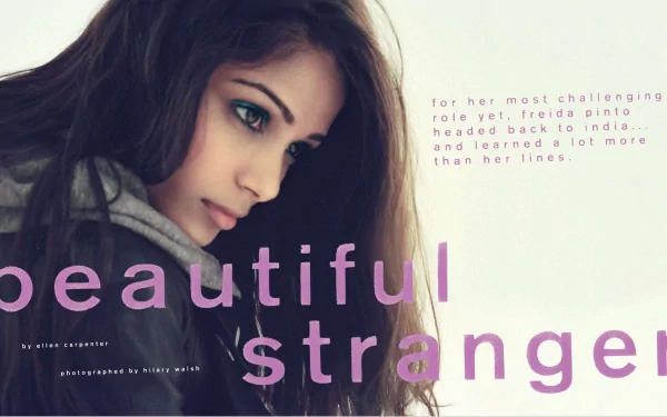 A striking HD desktop wallpaper featuring Freida Pinto, showcasing her contemplative expression alongside the text beautiful stranger, highlighting her journey in a challenging role.